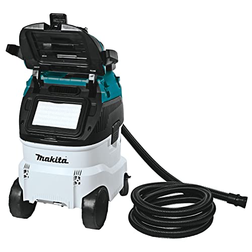 Makita dust extractor with its upper housing open to show the filter area